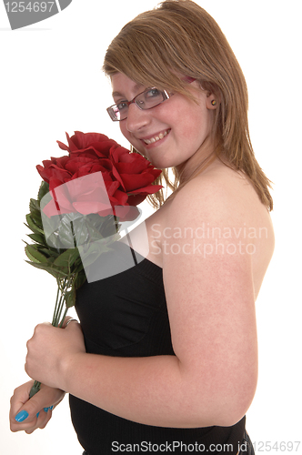 Image of Closeup of girl with roses.