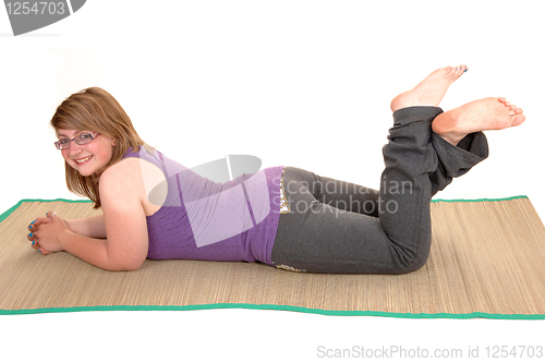 Image of Girl lying on stomach.