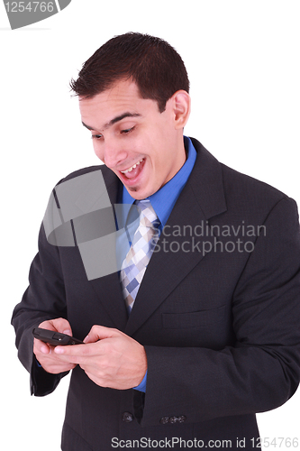 Image of young and smiling man looking at his cellphone 