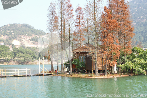 Image of wood house on water