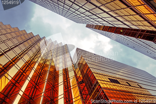 Image of Skyscrapers with clouds reflection 