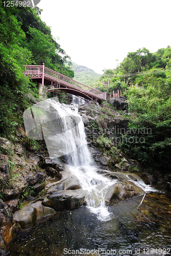 Image of Beautiful waterfall in the garden 