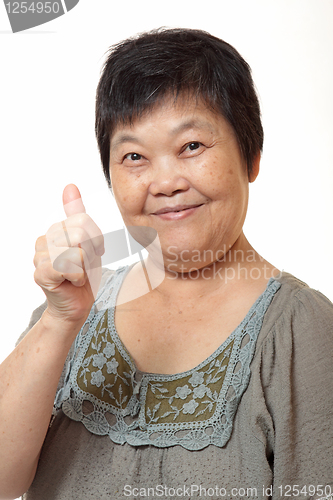 Image of Happy Asian young woman give you an excellent gesture with frien