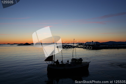 Image of Fishing boat at sunset