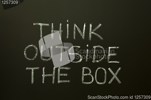 Image of THINK OUTSIDE THE BOX on a blackboard