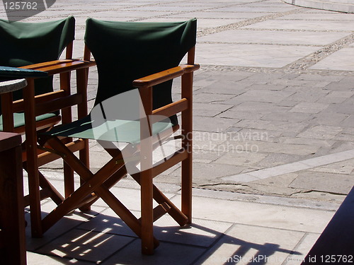 Image of Cafe chairs in the sun