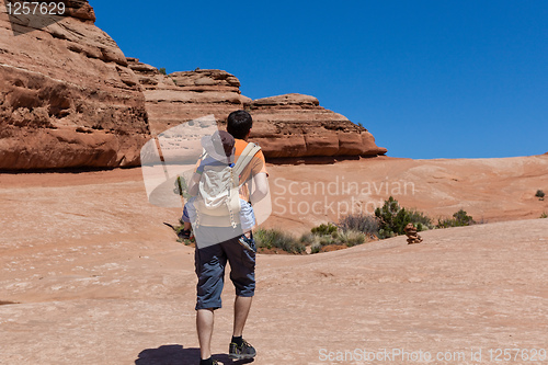 Image of father and son hiking