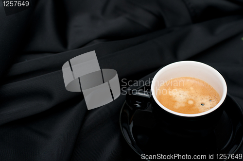 Image of Cup of Coffee on Black Drapery