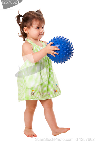 Image of Happy toddler girl with ball