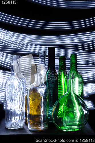 Image of empty bottles in the dark night