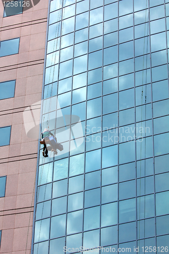 Image of window cleaner at work