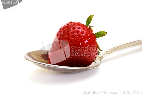 Image of Zoomed foto of strawberry lying on spoon