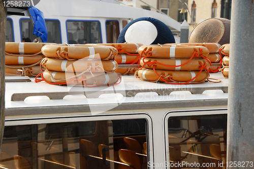 Image of Stacks of life belts on boat