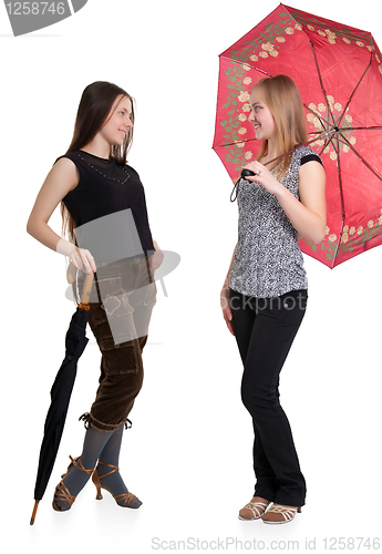 Image of Two girls with umbrellas