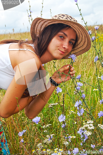 Image of The fine girl on field road