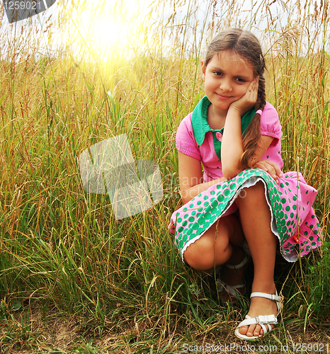 Image of  little girl on the meadow