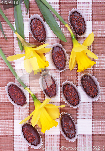 Image of Chocolates with yellow daffodils