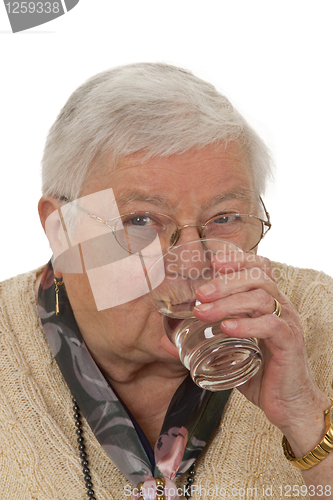 Image of Senior woman drinking water