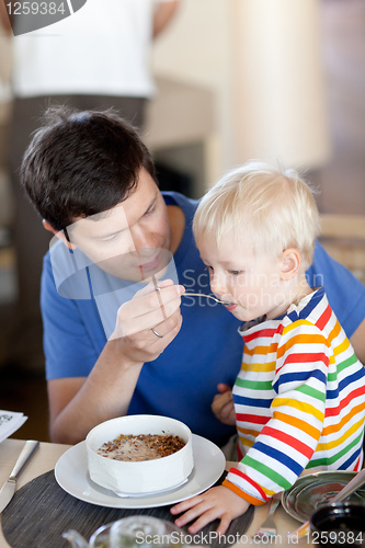 Image of father and son having a breakfast