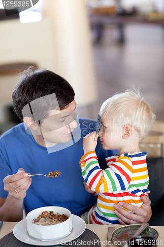 Image of father and son having a breakfast