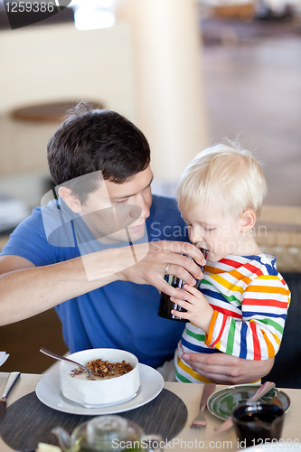 Image of father and son having a breakfast