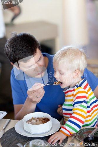 Image of father and son having a breakfast