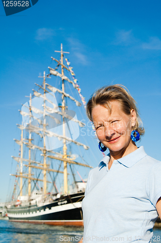 Image of The woman on a background of a sailing vessel