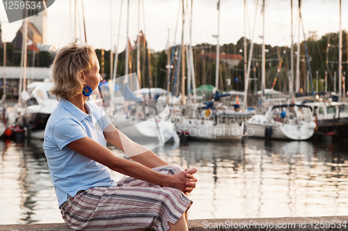 Image of The woman on a background of a sailing vessel