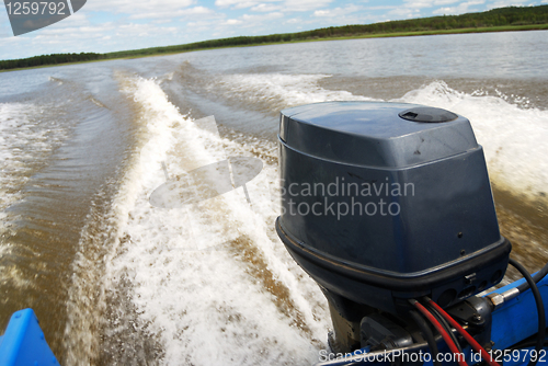 Image of outboard motor boat on the river