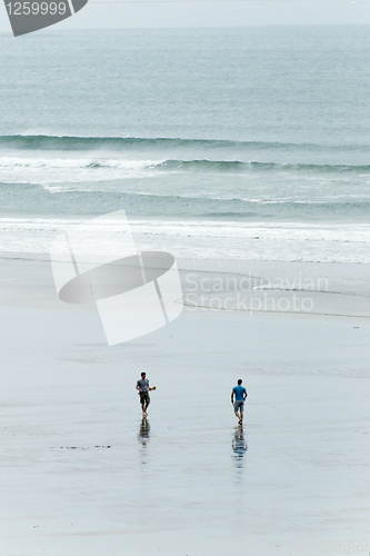 Image of Surfers walking
