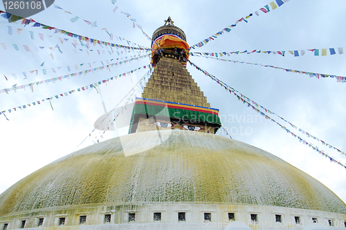 Image of Boudhanath Stupa and prayer flags in Kathmandu, Nepal