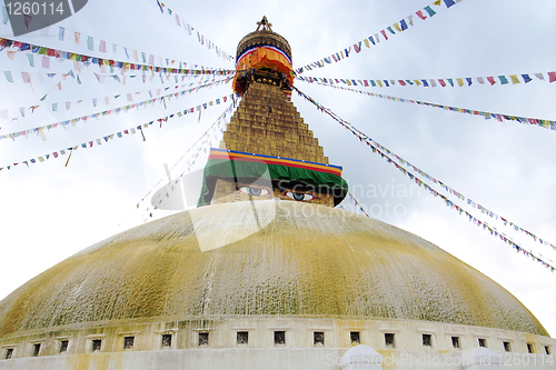 Image of Boudhanath Stupa and prayer flags in Kathmandu, Nepal