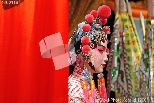 Image of chinese opera dummy and red cloth as text space ,it is a toy,not