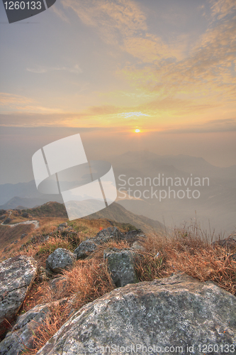 Image of mountain sunset and colored sky with clouds 