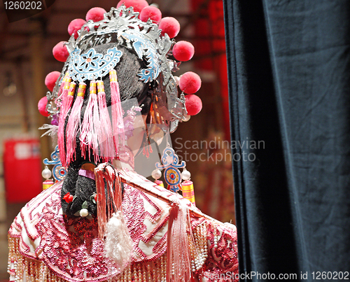 Image of chinese dummy opera, looking after the stage