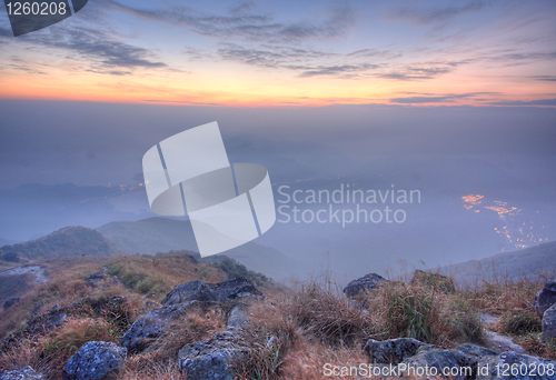 Image of mountain sunset and colored sky with clouds 