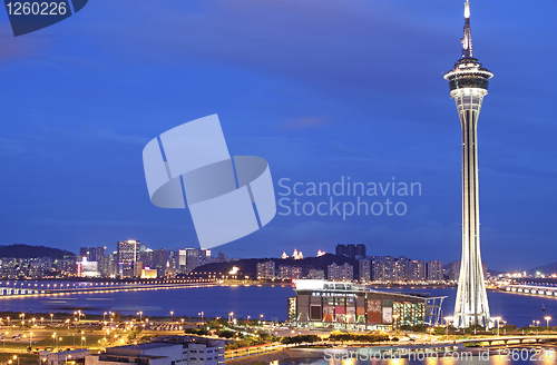 Image of Urban landscape of Macau with famous traveling tower under sky n