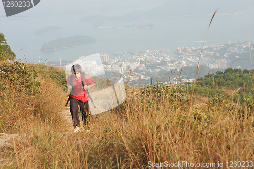 Image of Sport hiking in mountains, walking and backpacking 