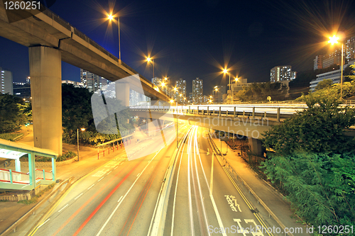 Image of Traffic through the city (traffic seen as trails of light) 