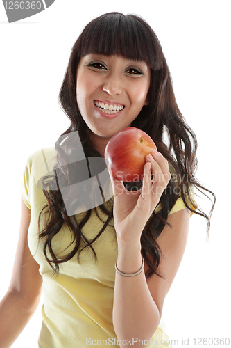 Image of Happy female eating healthy apple