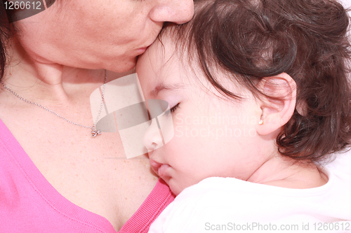 Image of Woman with sleeping baby 