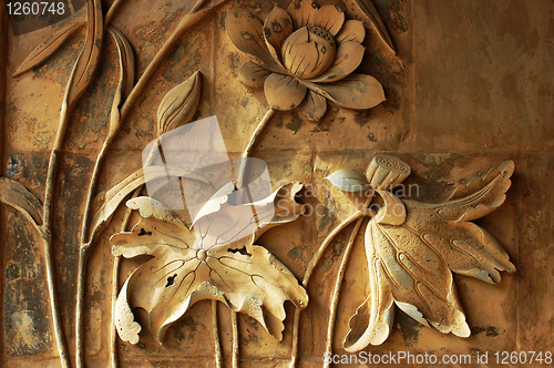 Image of Ancient brick carving art of lotus flowers 