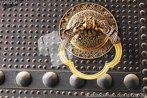 Image of Doorknob on an ancient iron door