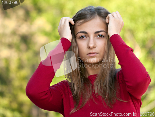 Image of beautiful girl in a red jacket