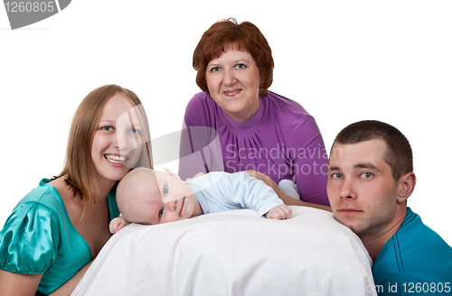 Image of mom, dad and grandmother with a baby