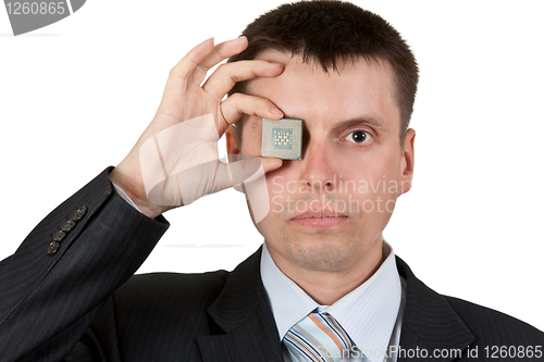 Image of Businessman closes one eye, a processor