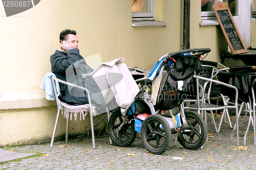 Image of Men on the street cafe