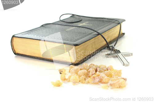 Image of incense with Bible and cross