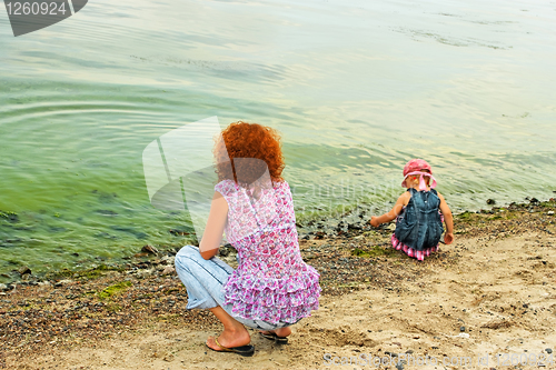 Image of Mother and daughter on the bank