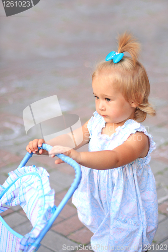 Image of Girl with toy pram